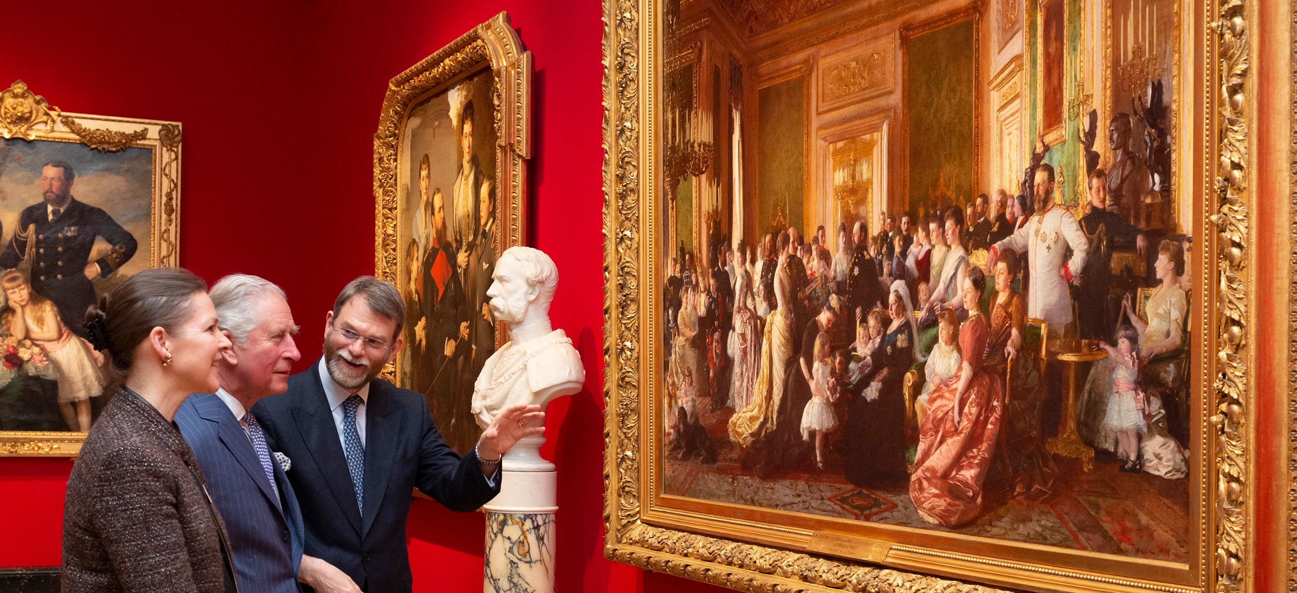 HM King Charles III visiting the exhibition 'Russia, Royalty & the Romanovs' with exhibition curators Caroline de Guitaut and Stephen Patterson