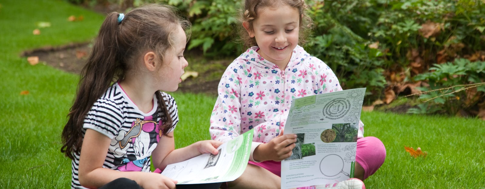 children looking at an activity trail in Buckingham Palace Garden