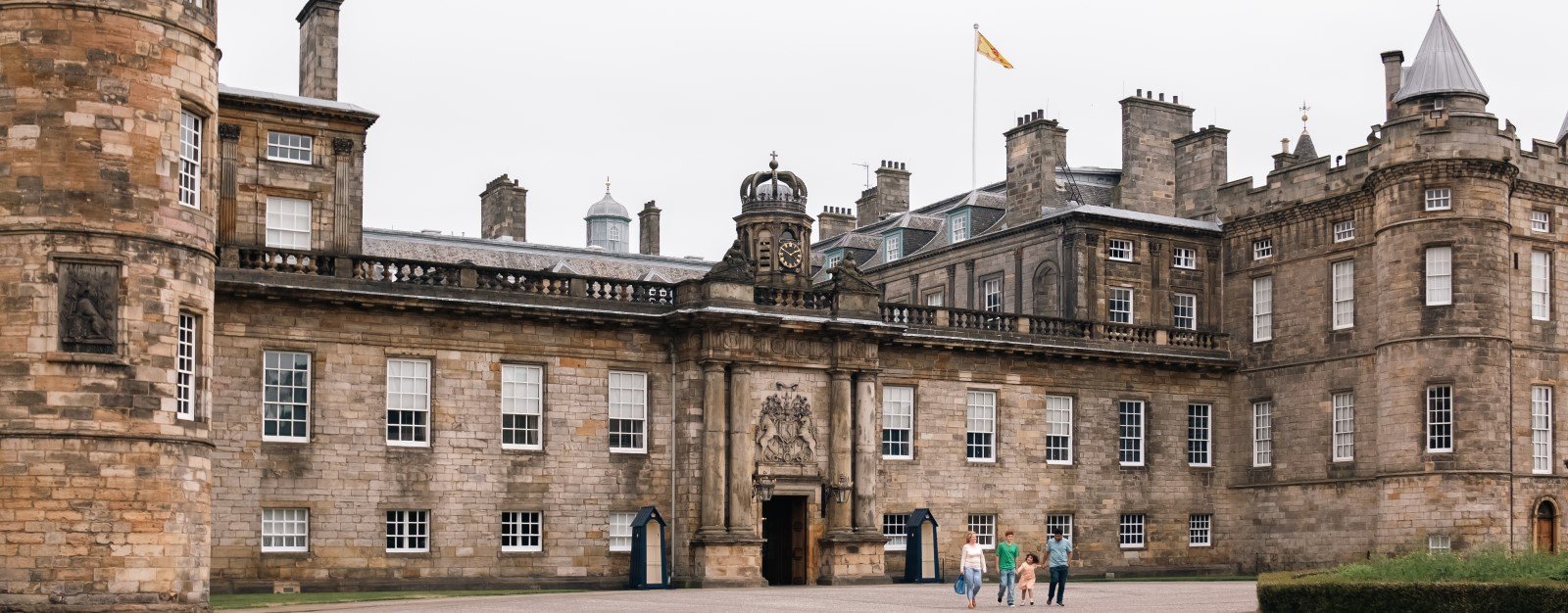 A family visiting the Palace of Holyroodhouse